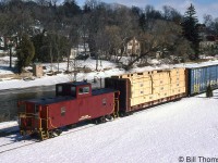 Ontario Southland van 4900 trails the freight lead by RS23's <a href=http://www.railpictures.ca/?attachment_id=39334><b>503 and 505</b></a>, running along the Speed River in Guelph on the Guelph Junction Railway.
<br><br>
4900 was an older steel center-cupola caboose (or van, in CP parlance) acquired by OSR from CP in 1998, and was formerly CP 434900 (it had been renumbered into that 4349xx international service number series from a previous 4341xx-series number). In recent years, it has been out of service and stored at Guelph Junction.