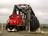 Yard engine returning from the Weyerhauser paper mill crosses the North Saskatchewan River on the west side of Downtown 