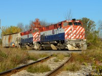  More BCRAIL to add to Joe Harrison's BCOL shot - while no longer BC Rail this pair still look great when put together.<br><br>
One of those days you're glad to have brought the camera to work, I found this train right after departing work and was surprised to find them facing west here - and in this light it really is a gift to appreciate. The rare part of this for Guelph fans is OSR would only be facing west here for Sanimax and Sanimax has been closed for years. The customer track is used for car storage only. The track in the foreground is for Westrock and is usually switched in the AM.