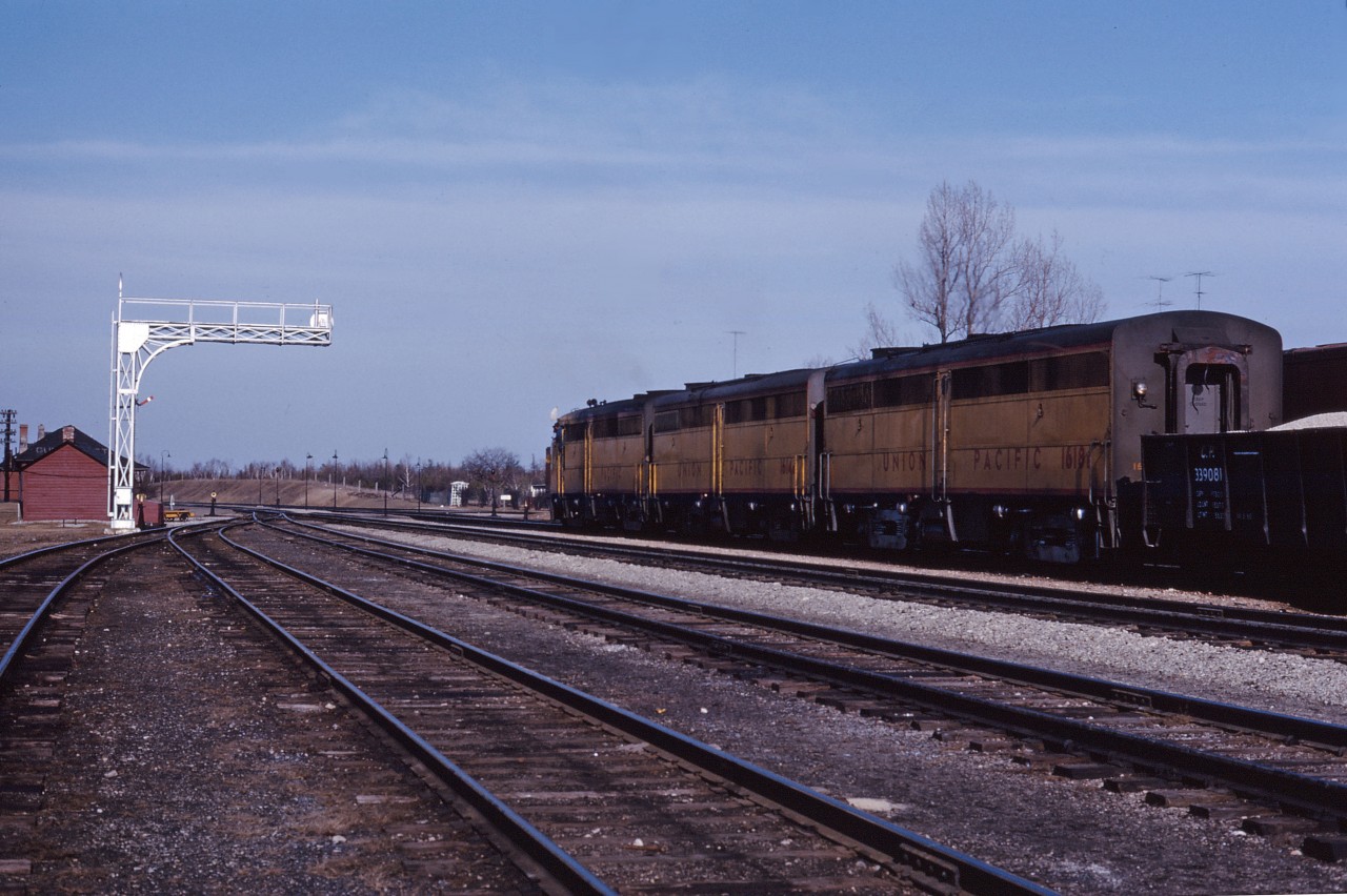 A trio of leased Union Pacific cab units (FA1 1641, FB1s 1614 and 1618) lead an eastbound through Guelph Junction in the spring of 1964.
