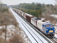It’s always interesting how we can spend a lot of time in certain areas and somehow completely over look photo locations. Whenever I take my boys out railfanning I always try to find safer locations to shoot then I might do when I’m on my own, seems I spend more time watching my boys then the trains. Just part of being a parent I guess. With the highway 59 overpass severely busy and snow covered we decided to look for other options for catching OSR’s return from Coakley siding. Luckily we stumbled across the entrance to the Thames River conservation area. Although closed for the season it provides a great bridge shot in both directions that is quiet and safe. I didn’t realize there were actually two sidings located here with the second signalled one most likely used for overflow Toyota traffic. This is where the OSR headed first to drop their train. In the photo here the train has just completed lifting potash cars from the west end of the siding and is now passing the east end of Coakley siding before heading back to Woodstock yard. Definitely a location I will return to at a later date.   
