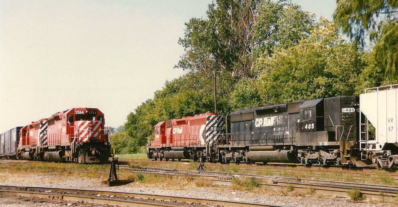 An eastbound train with SD40 5564 waits to depart Canadian Pacific's Quebec Street yard in London as a westbound train has just finished it's journey on the Galt Subdivision with SD40-2's 5585 and 5485. SD40 5564 was retired in 2001 and eventually sold for scrap while 5585 was retired in March 2008 and sold for scrap a year later as well.

SD40-2 5485 started life as Southern before becoming Norfolk Southern 3254 then to GATX 3254, eventually
being acquired by CP during 1992 and renumbered to CP 3254. Earlier in 1997, the unit was renumbered to CP 5485. CP retired the unit in 2003 and it was later sold to NRE in Mount Vernon, Illinois in 2004 becoming NREX 5485. Just over a year later in 2005, the unit was involved in a wreck in Momence, Illinois and was retired due to damage it received.

Notes on locomotives from http://www.mountainrailway.com.