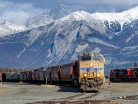 After changing crews in Jasper, loaded grain train G847 departs the south yard at Jasper with a very rare UP ES44AC leading the way. There's been give or take 10 UP units running up and down the Grande Cache Sub from the tailend of the summer until now, but every now and again they sneak west out onto the Edson Sub and beyond before returning. 