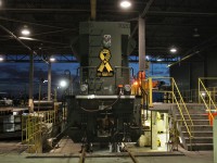 A rear view of SD70ACu CP 7020 over the covered outdoor inspection pit.