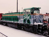 Rebuilt from a Burlington Northern B30-7A is Rail Power Technologies RP20BD 5404 passing through Agincourt Yard.