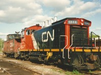 CN SW1200RS 1348 in it's new CN colours is sitting in Kitchener, Ontario on the evening of May 13, 1993. This was the last SW1200RS I ever saw assigned to Kitchener.