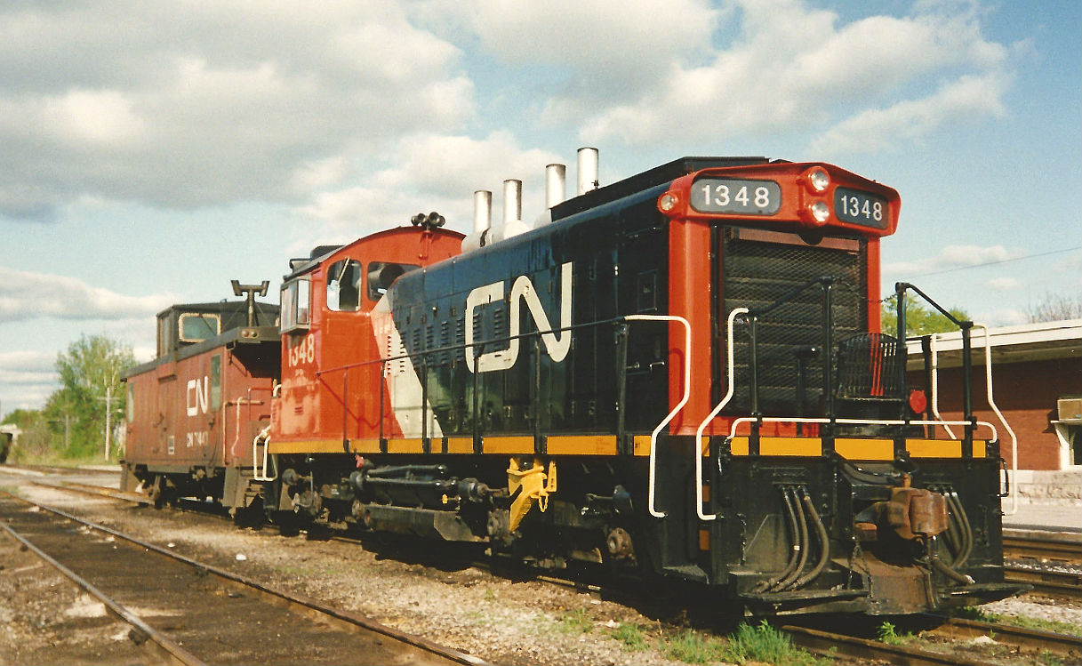 CN SW1200RS 1348 in it's new CN colours is sitting in Kitchener, Ontario on the evening of May 13, 1993. This was the last SW1200RS I ever saw assigned to Kitchener.