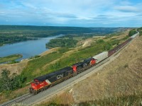 A delightfully rare morning move on the Fort St John Sub makes its way down north Taylor hill. The lead unit is about pass mile 719, the massive bridge across the Peace River bellow is located at mile 715. This is a hefty drop to make in 4 miles, only to then face the same grades up the other side.    
