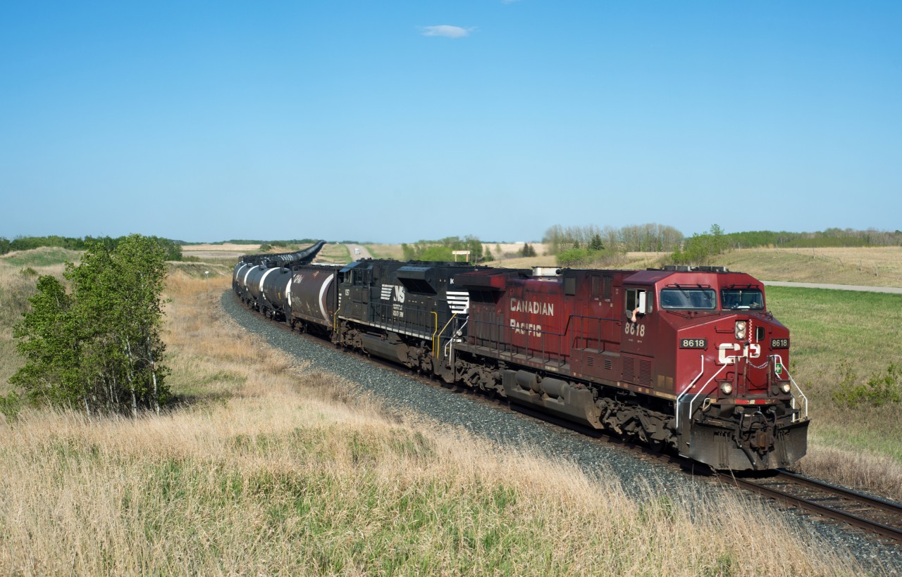 This afternoon trackside started out on the CN where eastbounds were being told they were going in the hole for at least 5 westbounds out of Saskatoon. However I got distracted by this CP when I overheard an interesting conversation. It was centred around the second unit (NS 1057) needing to be repositioned "behind the first trailing unit". Obviously this brought about some confusion as the NS 1057 was the only trailing unit. "Do you mean behind the first robot" the engineer eventually asked. Around this time I heard them go over the detector "total axles 8-4-0", and it all started to make sense. They were going to reconfigure the power arrangement from 2x1x1 to 1x2x1 on a double empty crude oil train. The plan was for them to this at the siding at Winter while 466 waited between switches on the main. Needless to say I got my shot and went back over to CN where things were actually moving.