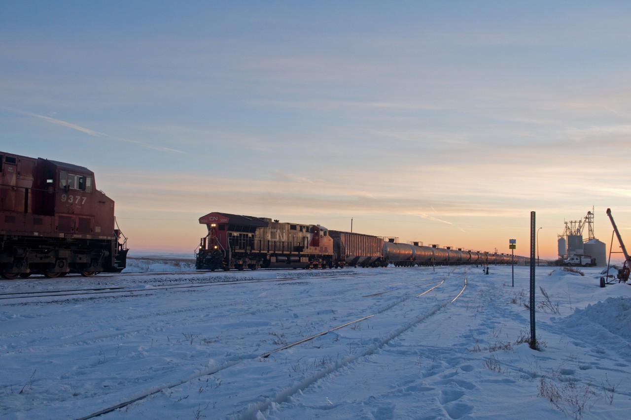 With 2019 in the bag, I figured I ought to dig out my first train shot of the year. Mid train DPU CN 3004 brings the second half of a 200+ car CP oil empty into Wilkie yard while CP 9377 East waits to depart for Saskatoon.