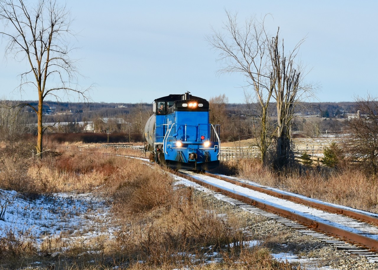 Making one last trip south to the Galt Sub to grab a couple last minute loads for Orangeville before the Holiday Shutdown, GMTX 333 approaches King st East while running through the farmlands of Caledon on-approach to the major city of Brampton with only one empty tanker car in tow this fine Christmas Eve morning. When today’s train reaches Snelgrove however, they’ll make a brief stop at the run-around track just north of Mayfeild rd as the ITP Armacell Plant in the northern end of Brampton just south of Sandalwood also had a empty hopper ready to be returned to CP and since their switch faces north, 333 will first have to drop the lone tanker car at the run-around and then run light power for about a mile into the Armacell Plant before taking the empty hopper back to Snelgrove and adding it onto today’s southbound train which has now doubled to 2 empties. Timing is 09:05