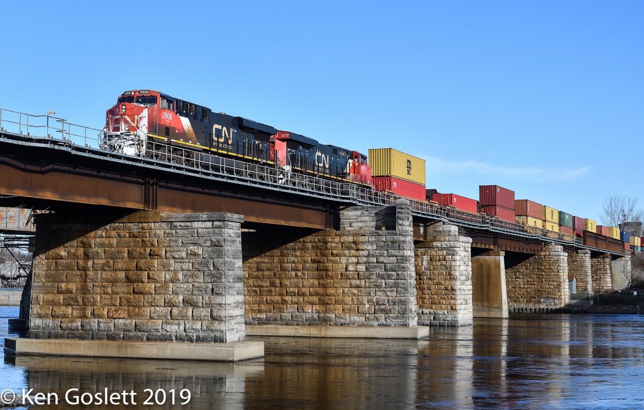 On a sunny Monday morning CN 149 crosses the Ste Annes bridge over the Ottawa River.