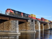 On a sunny Monday morning CN 149 crosses the Ste Annes bridge over the Ottawa River.