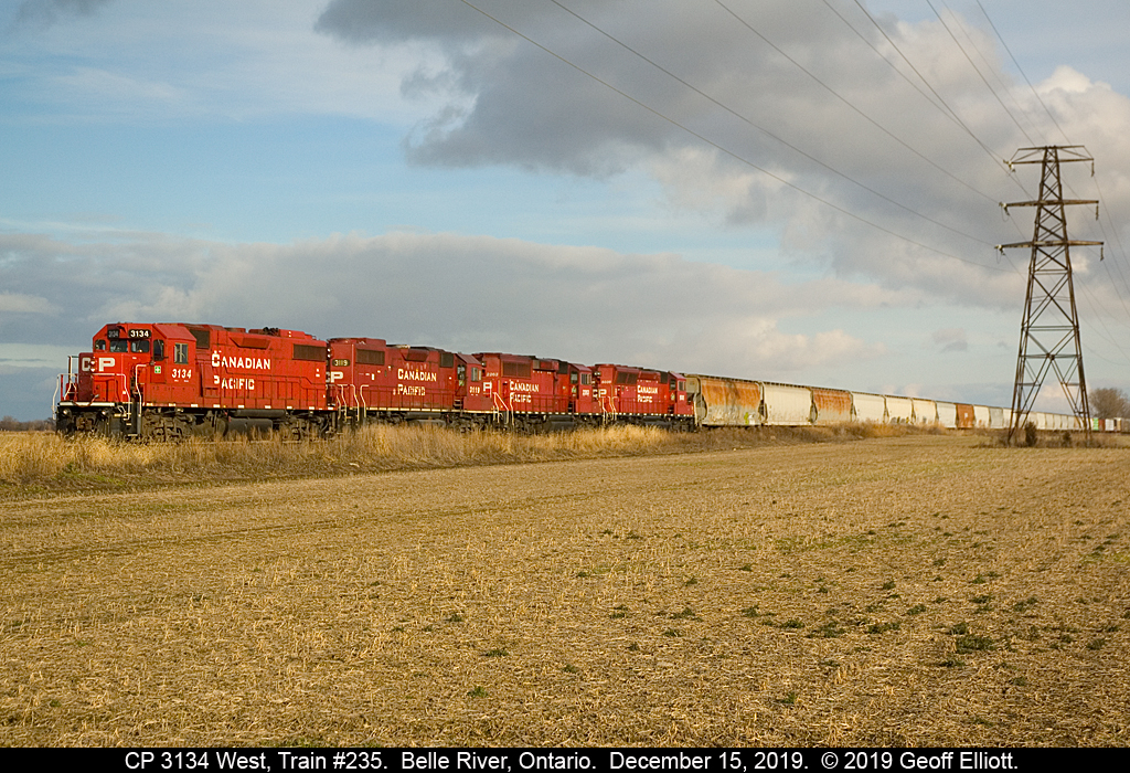 Looking like a "Blast from the Past", a quartet of non-GE Canadian Pacific units, with CP GP38-2 #3134 on point, lead westbound CP train #235 at Belle River, Ontario.  With 2 GP38-2's, a GP20Eco, and a SD30Eco trailing, the consist almost looks like a pure GMDD consist from the 80's and early 90's.  The train is holding here, just east of town, waiting on a westbound to take the siding here before continuing west to Windsor and then ultimately Detroit, Michigan.