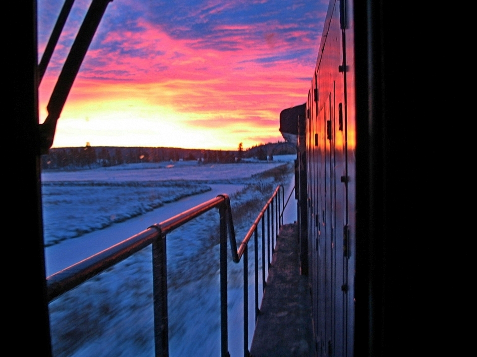 The morning commute of the Exeter Switcher, running south from Williams Lake to Exeter, switch the mills there and run back north. With the early morning red sky, we took warning of impending weather.