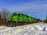 A trio of green power leads NBSR westbound train 907 at Prince William Station, New Brunswick. 