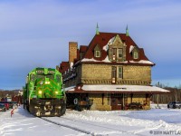 MNR 6340 leads NBSR train 907, as they pass the famous railway station in McAdam, New Brunswick, coming in for a crew change. 