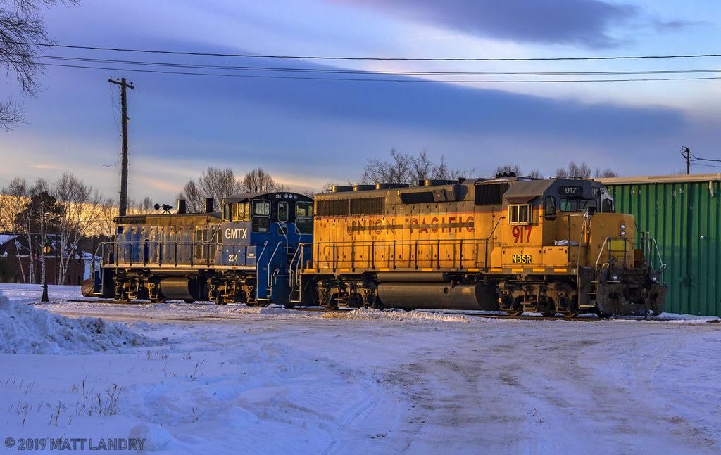 A pair of units sit idle at the shops at McAdam, New Brunswick. They are the power for the St Stephen Job, which runs from McAdam to St Stephen, and back. It would be neat to shoot these guys out on the mainline, but not on this day.
