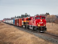 A photogenic pair of locomotives lumber a long and heavy no. 118 through the farm fields at Newtonville, Ontario. Upon departing Toronto Yard and providing their tonnage reading, RTC was nearly agasp by the numbers. "This is the heaviest train we've had all year", the conductor proclaimed. RTC responded with the slightest hesitation,  "Alright, well, give us an update on your speed once you get to Darlington. Over". Having made Darlington problem-free, 118 was still struggling to get up to track speed at Newtonville. Here, CP 7004 and KCS 5019 are pouring it on and brightening up an otherwise bland December's day. Slowly but surely knocking down the miles to Montreal.