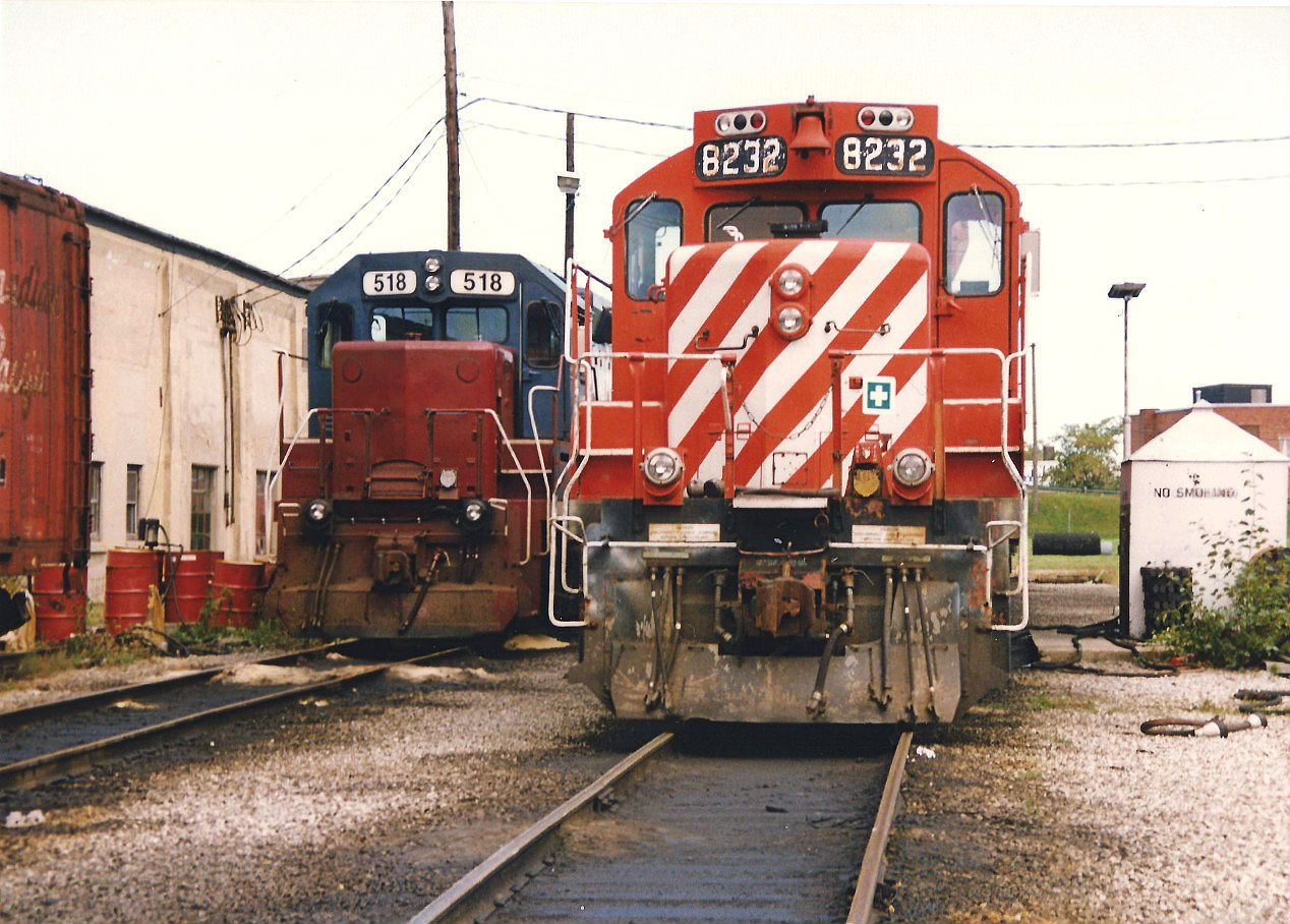 Two sets of power are seen at Canadian Pacific's Quebec Street yard in London. The power included, CP 8232/HATX 510 and HATX 518/HATX 517. At this time, CP was utilizing several 4-axle HATX/HELM leasing units on their local assignments across Southern Ontario on the STL&H.