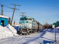 A quintet of Central Maine & Quebec SD40-2Fs ease US-bound train no. 2 along the snow-covered back streets at Lennoxville, Quebec on a glorious winter's morning.
 
At the time (for reasons to me now unknown), I was very disappointed with the results of this chase. I had accidentally set the image stabilizer on my lens to "Mode 2", which I was convinced had ruined my photographs. However, less than a year removed from that fateful February morning, and with the news of CP's impending takeover, I can easily look past whatever bad maple syrup I was drinking. Time heals all.