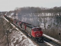 Running from Fort Erie to Toronto, train #432 is photographed from then almost new Walkbridge over the tracks at the Royal Botanical gardens. Power is CN 9571, with 3 GP9s trailing,  4513, 4577 and 4567. I did not take a car count but did note the caboose was #79395.