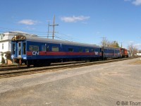 CN's Test Train (or "TEC" train) is shown on the Kingston Sub at Coteau QC in April 1998. Power leading the two cars today is CN GP9RM 7065.