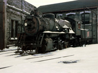 Here we have another shot of "heavy" yard engine 8304, an 0-8-0, in storage next to the Hamilton roundhouse (with the bunk house in the background). According to Ian Wilson's book, the 8304 was the last steam yard engine used in Hamilton on May 15, 1959. 