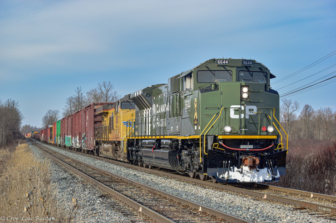 CP 118 with 6644 leading and 7010 mid-train pass Carroll Rd. outside of Smiths Falls. The train would go on to do some shunting in the yard before continuing their trip East.
