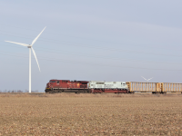 CP 235 with the first of the 5 Military units to venture down into Southwestern Ontario rolls through the flat harvested landscape of Essex County. Many will say that the Wind Turbines littered around this area are an eye sore. 