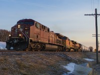 <b> MORNING HAS BROKEN! </b>  Nothing like an early morning catch, especially when it is unplanned! Here 141 crosses Third Line just outside of Chatham. The give away was a red signal, then the headlights appeared. Quick setup, but couldn't be happier than having not one, but TWO BNSF 'pumpkins' in the mix.