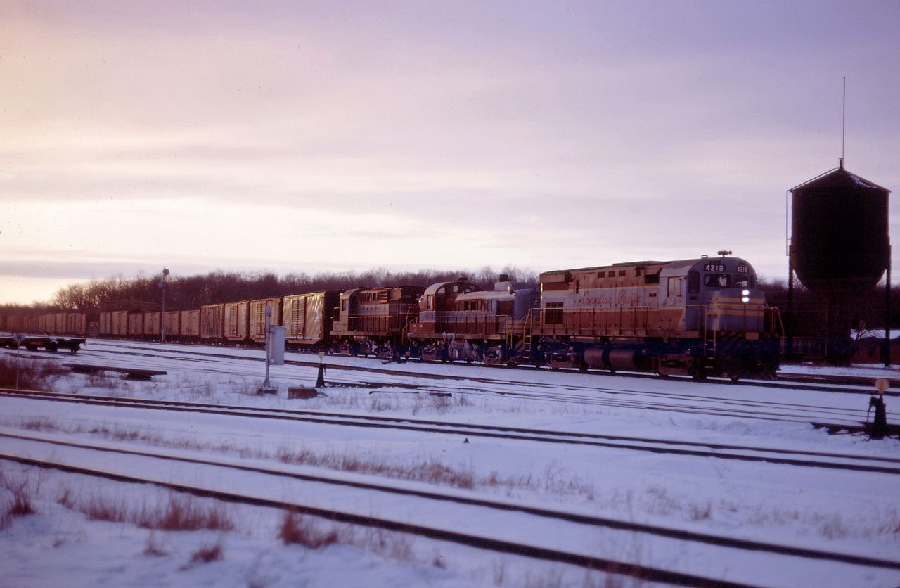 CP C424 4218, RS3 8454, and RS18 8779 lead an eastbound through Guelph Jct on a winter's afternoon in early 1966.