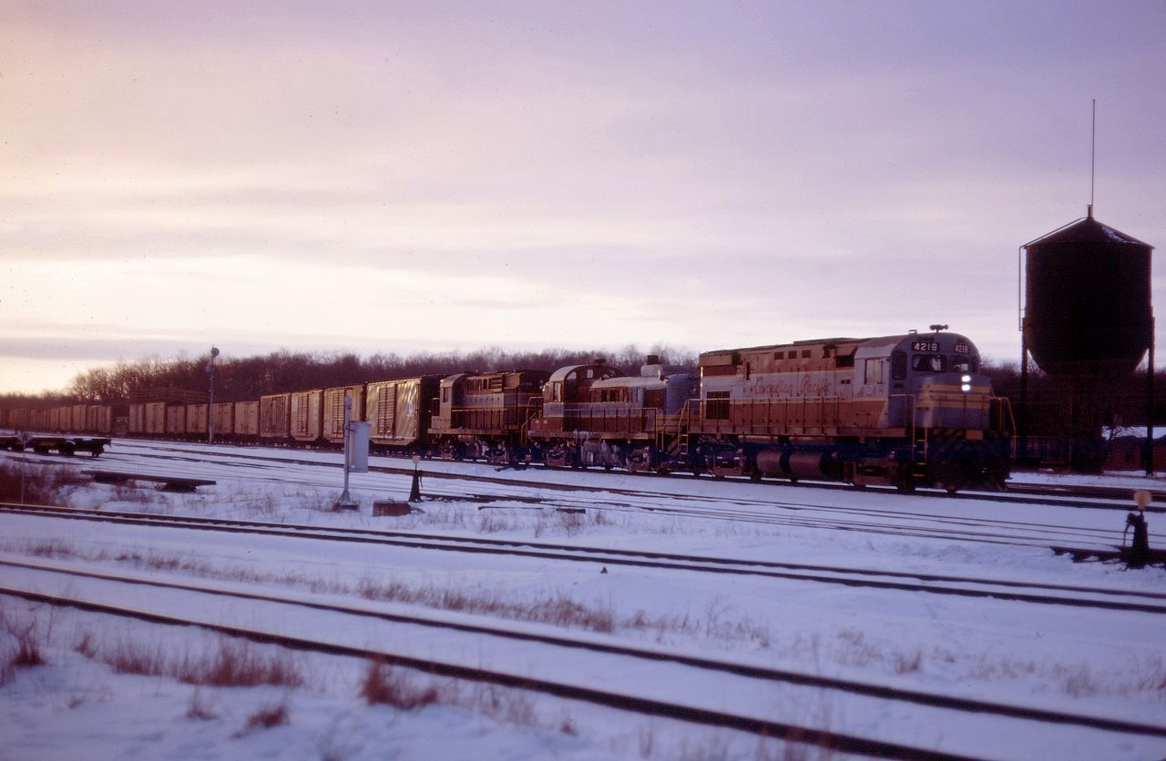 CP C424 4218, RS3 8454, and RS18 8779 lead an eastbound through Guelph Jct on a winter's afternoon in early 1966.