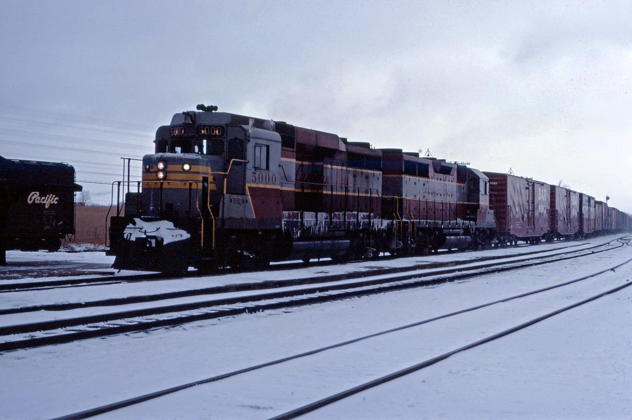 CP GP30 5000 and GP35 5018 lead a westbound freight with traffic from the "International of Maine" Division through Guelph Junction on a dull day in January 1967.