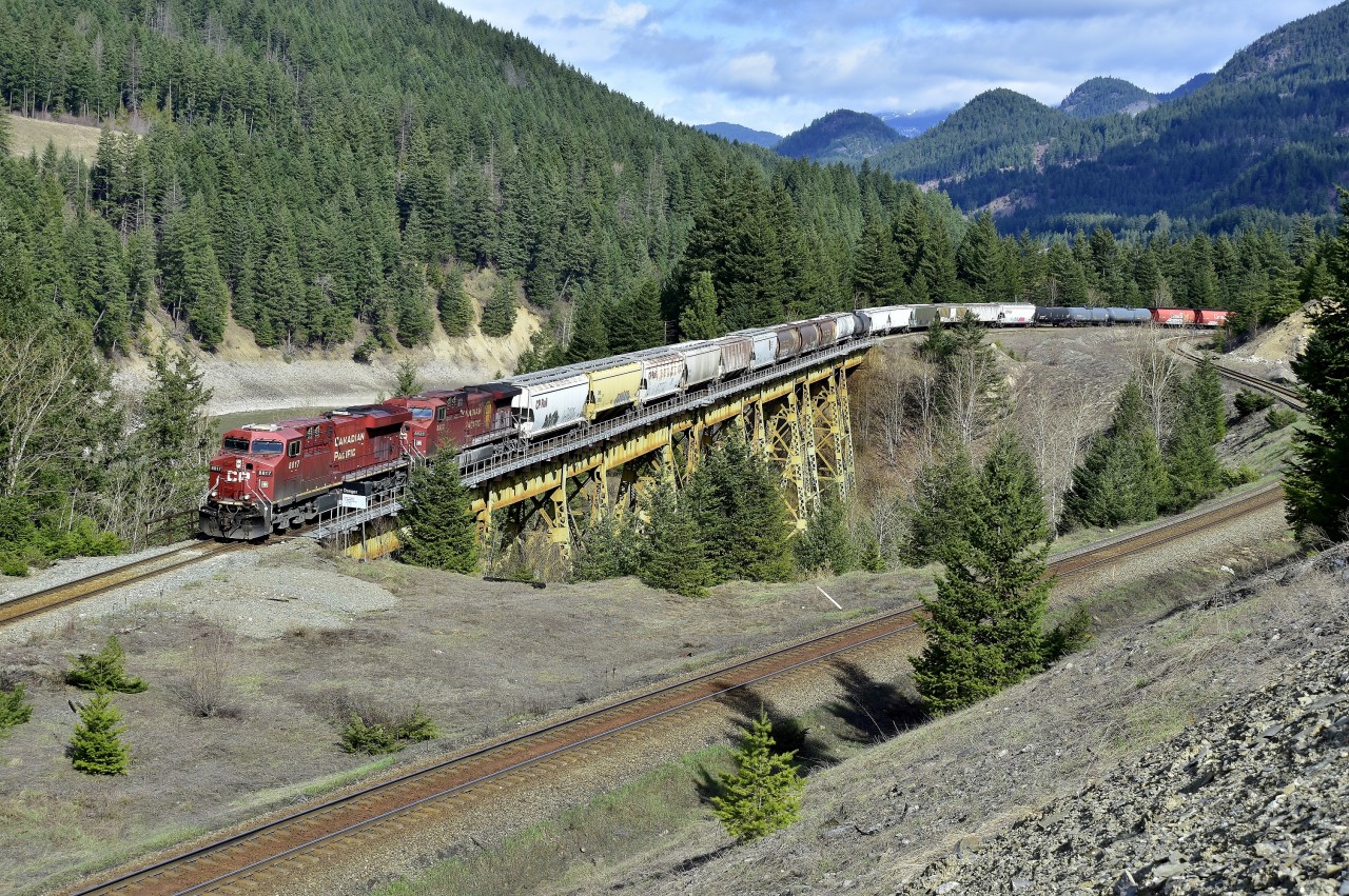 CP 8817 leads a westbound load of grain across the Stoyoma Creek trestle near Boston Bar. These tracks belong to CN but due to directional running they carry all westbound traffic in this area.