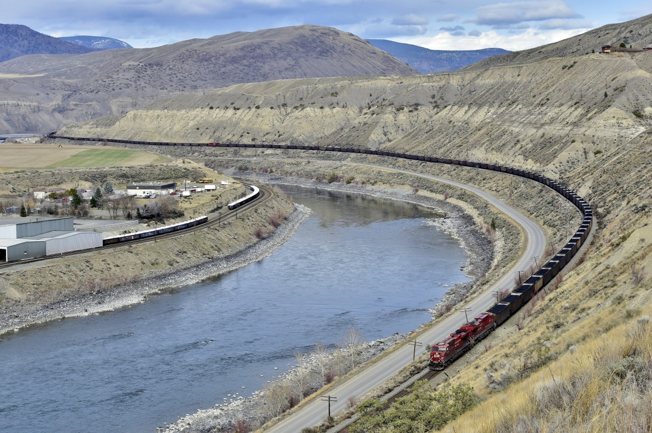 A loaded westbound CP coal train is seen approaching Ashcroft led by CP 8764.This view shows about 120 of the typical 152 cars that make up one of these trains, and also visible is the mid-train remote.