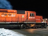 I was leaving town following two days of Holiday Train chasing and came across this idling dash-2 right near a crossing. Thought it would be a nice night long exposure. I parked, rifled around for my tripod and by the time I got up to the crossing, it was notching up to full smoke ahead so I had to fire off a grab pan shot. Nice to see these old diesels still running-it takes me back!