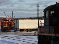 My favorite engine in Sudbury has seen better days but not the end of days just yet, future engine test bed 5391 enjoys the evening sun ahead of parts source DESX 5308 (was CN) while CN 7232 awaits it's turn inside the newly constructed shop to my right. Diesel Electric recently finished this new building and tracks in the foreground this year and has very been busy servicing just about everything CN from SD75i's, to orange DMIR tunnel motors, to WC SW1500's!<br><br>Built in 1978 for CP as #5782, it was one of 2 groups of engines (CP 5779-5789 and 5860-5864) purchased by Ontario Hydro to power their unit coal trains from BC/SK to Thunder Bay, ON. Sometime around 1995 Ontario Hydro let the contract expire and the remaining engines were reassigned between CN and CP, this one becoming CN 5391 in May of 1996 and being the only one CN held onto after selling the others back to CP in 2000. CN 5391 was retired April 2008, sold to NRE Capreol and eventually dealt to DESX in Sudbury sometime in 2008, and for the last decade has been moved around this scrap yard just off the CN Sudbury spur providing parts to other DESX rebuilds. <br><br>To compare, here's how it looked shortly after retirement/arriving at DESX in 2008: <a href="http://www.railpictures.ca/?attachment_id=8832"> http://www.railpictures.ca/?attachment_id=8832 </a><br><br> Another look from 2010, quite a few obvious parts missing since then! <a href="http://www.railpictures.ca/?attachment_id=6869"> http://www.railpictures.ca/?attachment_id=6869 </a><br><br>I'd like to thank Wilco van Schoonhoven for all this information from his excellent website <a href="http://www.mountainrailway.com"> http://www.mountainrailway.com </a>, I haven't been able to find any other website with as much detail on this Hydro deal or most other engines that catch my interest as his, much appreciated Wilco thank you! 