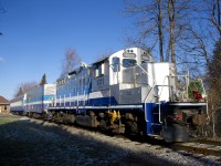 The Exporail's Christmas train is sitting at the Des Bouleaux Station with a solid AMT consist (GP9 AMT 1311, generator car AMT 603 and coach AMT 827). With temperatures well below freezing, the generator car is being put to good use for keeping the passengers warm. 