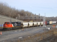 A late CN 305 is about to stop at Turcot Ouest, where the Joffre crew will be replaced by a Montreal crew. CN 8820 is up front and CN 2117 is mid-train on this 142-car Moncton-Toronto train.