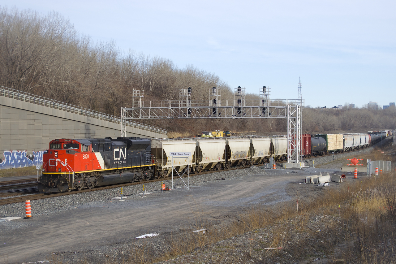 A late CN 305 is about to stop at Turcot Ouest, where the Joffre crew will be replaced by a Montreal crew. CN 8820 is up front and CN 2117 is mid-train on this 142-car Moncton-Toronto train.
