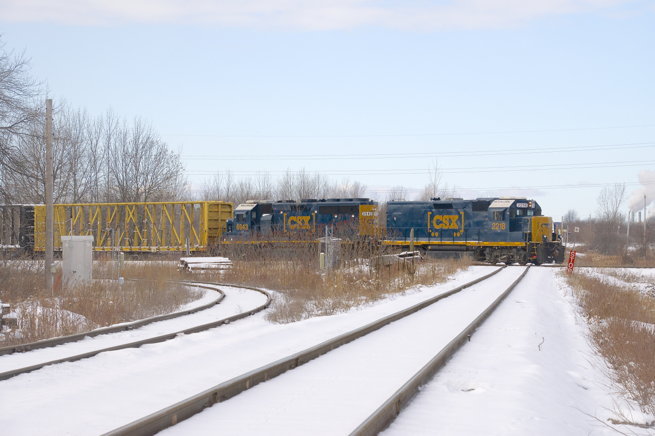 With roadslug CSXT 2218, GP40-2 CSXT 6943 and 6 cars, CSXT B763 is crossing the CSX/CN diamond at Cecile Jct on its way to terminating in nearby Beauharnois. The CSX tracks are likely to become CN's once their acquisition of this line is finalized.