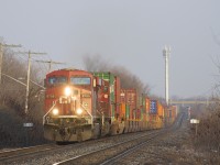 CP 8755 & CP 8546 are leading a short but 100% intermodal CP 143 past MP 12 of CP's Vaudreuil Sub as some nice winter light illuminates the scene.