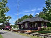 <br>
<br>
 A stunning restoration – inside and out – and meticulously maintained....
<br>
<br>
  ex CPR Bristol station built on this site 1910, was removed in 1971
<br>
<br>
 The ex CPR Florenceville station, built 1914, was moved to this site in 2000
<br>
<br>
 the station site and rail cars are a tourist bureau, museum, 'Fresh' fine dining, 'Shamrock' train inn. 
<br>
<br>
 August 30, 2019 at the Shogomoc Railway site, Bristol, N. B., digital by S.Danko
<br>
<br>
 the passenger cars at Bristol:
<br>
<br>
  ex CPR 4490,  Baggage – Sleeper  4490 ( built  CC& F February 1930 )
  ex CPR Assiniboine, Tourist Sleeper Gimli ( built  CC&F  November 1919 )
  ex CPR Grenfell, Tourist car ( built CC&F September 1931 )
   [ merci Trackside Guide] 
<br>
<br>
  On August 30 2019  the Shogomoc Railway train board recorded:
 	Shogomoc Railway train #09 to Fredericton 10am - on time [ missed it ! ] 
 	Shogomoc Railway train # 4 to McAdam 11:45am – delayed
	Shogomoc Railway train #26 to Woodstock 1:30pm - delayed
	Shogomoc Railway train #33 to Bath 3:30pm – on time [ could not wait for it ! ]
	Shogomoc Railway train #45 to Aroostock 5:00pm - cancelled
 <br>
<br>
 That radio mast appeared to be functional.
 <br>
<br>
sdfourty