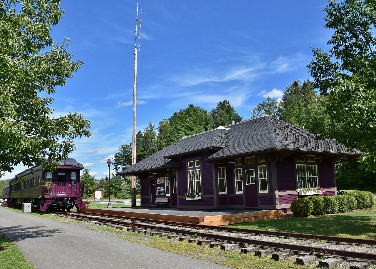 A stunning restoration – inside and out – and meticulously maintained....


  ex CPR Bristol station built on this site 1910, was removed in 1971


 The ex CPR Florenceville station, built 1914, was moved to this site in 2000


 the station site and rail cars are a tourist bureau, museum, 'Fresh' fine dining, 'Shamrock' train inn. 


 August 30, 2019 at the Shogomoc Railway site, Bristol, N. B., digital by S.Danko


 the passenger cars at Bristol:


  ex CPR 4490,  Baggage – Sleeper  4490 ( built  CC& F February 1930 )
  ex CPR Assiniboine, Tourist Sleeper Gimli ( built  CC&F  November 1919 )
  ex CPR Grenfell, Tourist car ( built CC&F September 1931 )
   [ merci Trackside Guide] 


  On August 30 2019  the Shogomoc Railway train board recorded:
 	Shogomoc Railway train #09 to Fredericton 10am - on time [ missed it ! ] 
 	Shogomoc Railway train # 4 to McAdam 11:45am – delayed
	Shogomoc Railway train #26 to Woodstock 1:30pm - delayed
	Shogomoc Railway train #33 to Bath 3:30pm – on time [ could not wait for it ! ]
	Shogomoc Railway train #45 to Aroostock 5:00pm - cancelled
 

 That radio mast appeared to be functional.
 

sdfourty