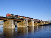 CN 369 has CN 2943 & CN 9543 up front (and CN 2806 mid-train) as it crosses the Ottawa River with ingots of aluminum up front. CN 9543 will be set off at Brockville.