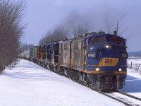 Its a sunny day and the right unit is leading... life is good.  A hefty 580 makes its way down the Goderich Sub just east of Seaforth with 1400, 1401, 4001, LLPX2263, 4046, and 3835 up front. 