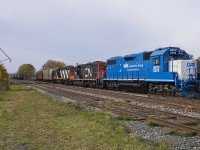 It has been awhile since I last shot some action in Thamesville. Last time I was there, I had met up with both rp.ca contributors, Hunter Holmes and Luke Bellefleur. Of course, at that time being at the tender age of 41 I'm the 'senior' out of the three of us. Of course, having a then 2 year old in tow didn't help me to catch up with their young and energetic enthusiasm of photographing 514 working in Thamesville. Thankfully, this time was different. After getting a tip of 514 working in Thamesville, I arrived 'sans child' and to my surprise found GMTX 2274 leading the way with the sun out. Awesome day, awesome catch - as the sun was out for just enough time before it clouded over.