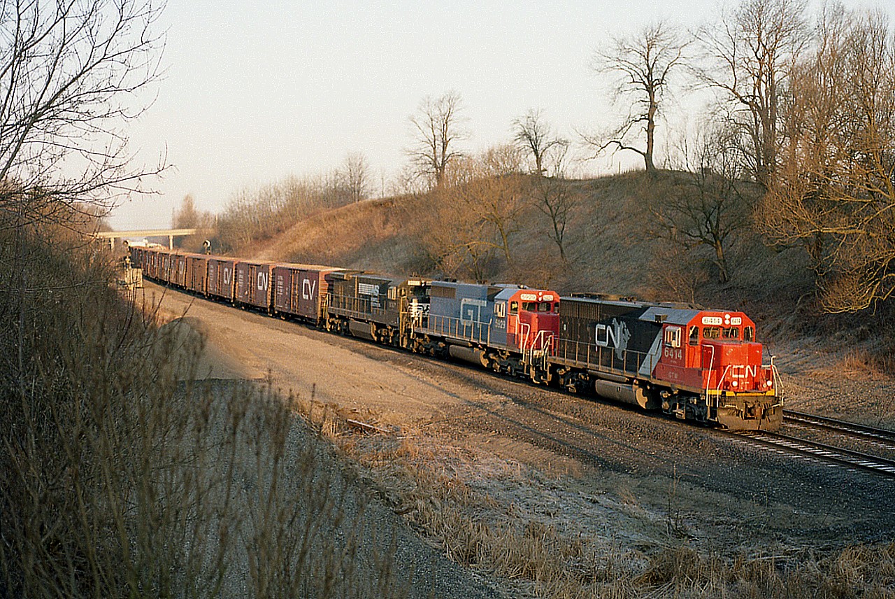 April is the time of the year when the sun hits the tracks earliest at the Inksetter Rd location of the Dundas Sub. Sunrise right down the line.  Note the length of the pole shadow!!!
Rather nice power assortment on this #390 as well: GTW 6414, GT 5929 and NS 8007. My notes indicated I left  for home around 1500h after logging 16 trains, and this image pictured was my third of the day already.