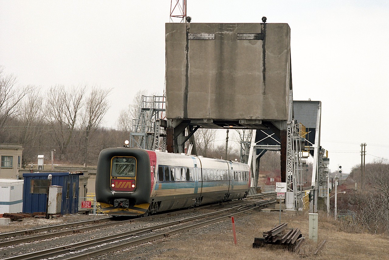 The IC-3 Flexliner demonstrator, one of 2 sets running over VIA in hopes that they might catch on, was something of a bust. These units were designed and built by ADtranz, a new company spinoff of Daimler-Benz and ABB.
In Ontario they first hit the scene the 29th of Sept 1996 and were pulled the next day. One of the flaws was they did not reliably activate track circuity. After 7 weeks of modifications and tests they went back into service. One set ran until late March and the other early May 1997.  VIA said no to them.
This image shows a Niagara-bound set crossing Bridge 6 over the Welland Canal on a rather gloomy day.

In Europe over 200 sets of these Flexliners were in operation in mid 1996.